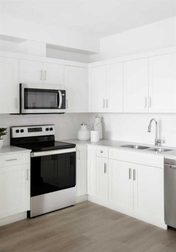 1316-14910 1 Street Nw, Calgary, AB - Indoor Photo Showing Kitchen With Stainless Steel Kitchen With Upgraded Kitchen