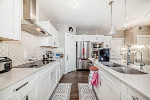 405-10 Walgrove Walk Se, Calgary, AB - Indoor Photo Showing Kitchen With Stainless Steel Kitchen With Double Sink With Upgraded Kitchen
