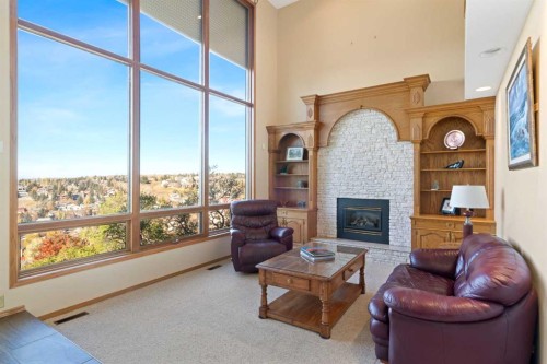 79 Edenstone View Nw, Calgary, AB - Indoor Photo Showing Living Room With Fireplace