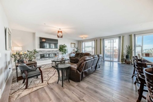 113 Howse Mount Ne, Calgary, AB - Indoor Photo Showing Living Room With Fireplace