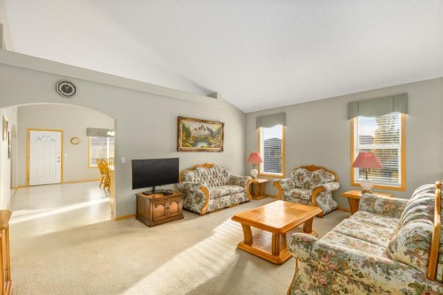 131 Panatella Close Nw, Calgary, AB - Indoor Photo Showing Living Room