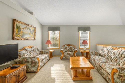 131 Panatella Close Nw, Calgary, AB - Indoor Photo Showing Living Room