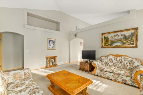 131 Panatella Close Nw, Calgary, AB - Indoor Photo Showing Living Room