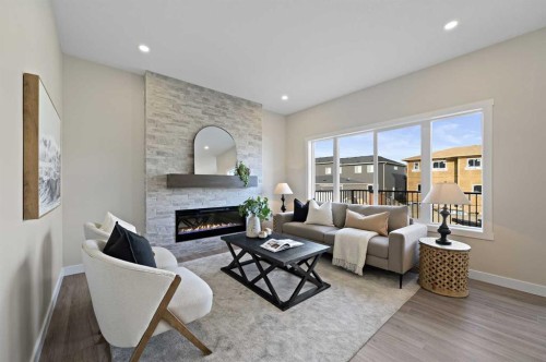 634 Bayview Lane Sw, Airdrie, AB - Indoor Photo Showing Living Room With Fireplace