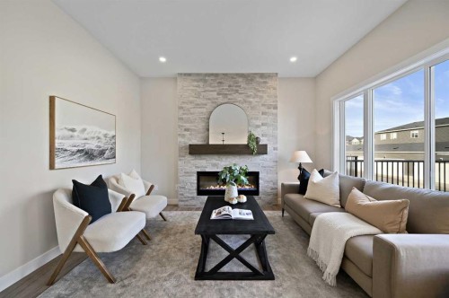 634 Bayview Lane Sw, Airdrie, AB - Indoor Photo Showing Living Room With Fireplace