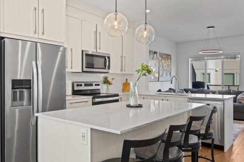 602-335 Creekside Boulevard Sw, Calgary, AB - Indoor Photo Showing Kitchen With Upgraded Kitchen