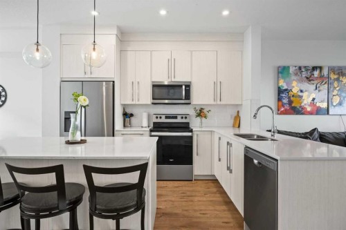 602-335 Creekside Boulevard Sw, Calgary, AB - Indoor Photo Showing Kitchen With Double Sink With Upgraded Kitchen
