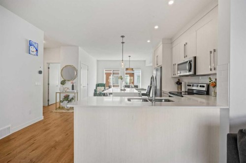 602-335 Creekside Boulevard Sw, Calgary, AB - Indoor Photo Showing Kitchen With Double Sink With Upgraded Kitchen