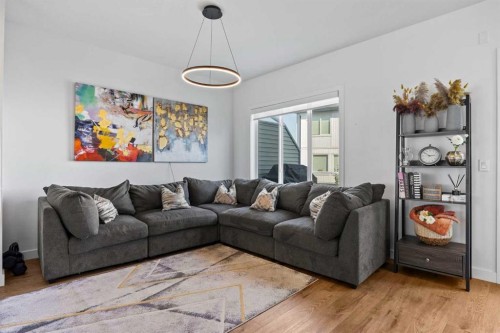 602-335 Creekside Boulevard Sw, Calgary, AB - Indoor Photo Showing Living Room