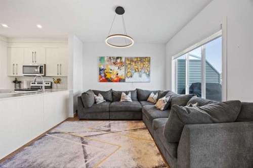 602-335 Creekside Boulevard Sw, Calgary, AB - Indoor Photo Showing Living Room