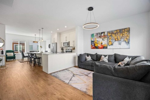 602-335 Creekside Boulevard Sw, Calgary, AB - Indoor Photo Showing Living Room