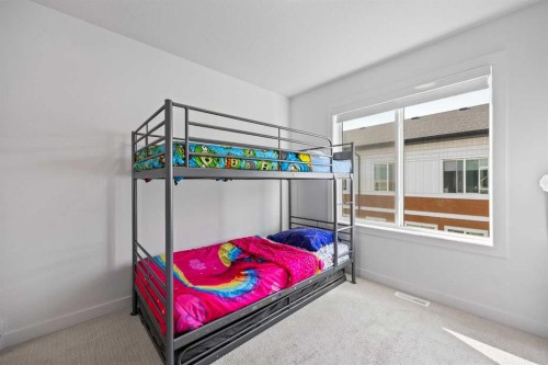 602-335 Creekside Boulevard Sw, Calgary, AB - Indoor Photo Showing Bedroom