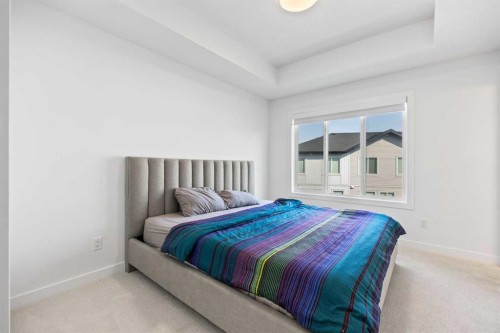602-335 Creekside Boulevard Sw, Calgary, AB - Indoor Photo Showing Bedroom