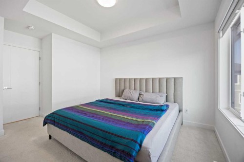 602-335 Creekside Boulevard Sw, Calgary, AB - Indoor Photo Showing Bedroom