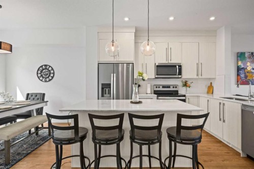 602-335 Creekside Boulevard Sw, Calgary, AB - Indoor Photo Showing Kitchen With Upgraded Kitchen