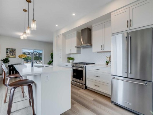 1306-200 Southridge Drive, Okotoks, AB - Indoor Photo Showing Kitchen With Stainless Steel Kitchen With Upgraded Kitchen