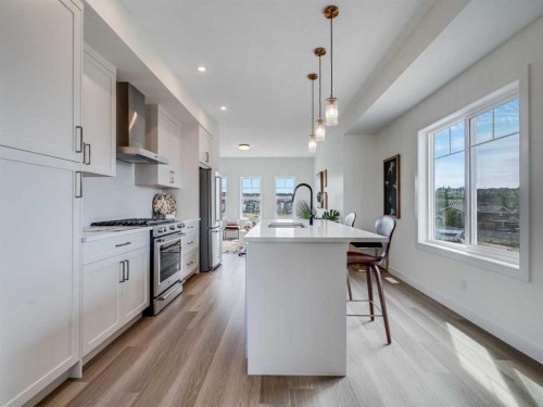 1306-200 Southridge Drive, Okotoks, AB - Indoor Photo Showing Kitchen With Upgraded Kitchen