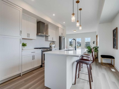 1306-200 Southridge Drive, Okotoks, AB - Indoor Photo Showing Kitchen With Upgraded Kitchen