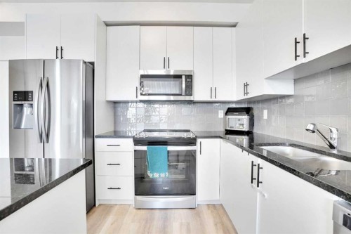4416-15 Sage Meadows Landing Nw, Calgary, AB - Indoor Photo Showing Kitchen With Stainless Steel Kitchen With Double Sink With Upgraded Kitchen
