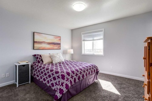 251 Kingsbridge Road Se, Airdrie, AB - Indoor Photo Showing Bedroom