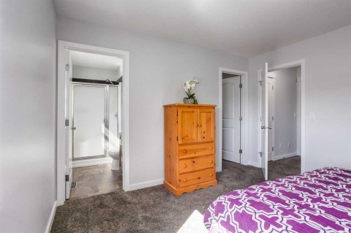 251 Kingsbridge Road Se, Airdrie, AB - Indoor Photo Showing Bedroom