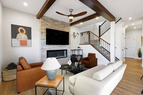 16 Key Cove Sw, Airdrie, AB - Indoor Photo Showing Living Room With Fireplace