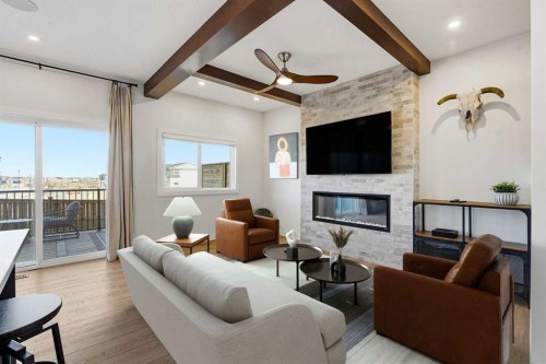 16 Key Cove Sw, Airdrie, AB - Indoor Photo Showing Living Room With Fireplace