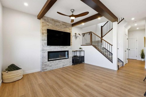 16 Key Cove Sw, Airdrie, AB - Indoor Photo Showing Living Room With Fireplace