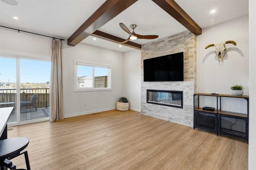 16 Key Cove Sw, Airdrie, AB - Indoor Photo Showing Living Room With Fireplace