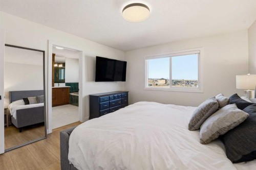 16 Key Cove Sw, Airdrie, AB - Indoor Photo Showing Bedroom