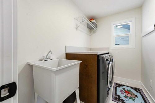 16 Key Cove Sw, Airdrie, AB - Indoor Photo Showing Laundry Room