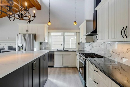 3020 Palliser Drive Sw, Calgary, AB - Indoor Photo Showing Kitchen With Double Sink With Upgraded Kitchen