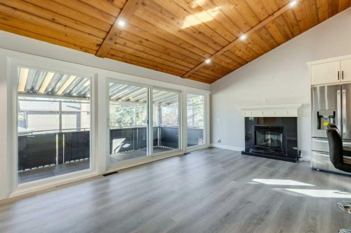 3020 Palliser Drive Sw, Calgary, AB - Indoor Photo Showing Living Room With Fireplace