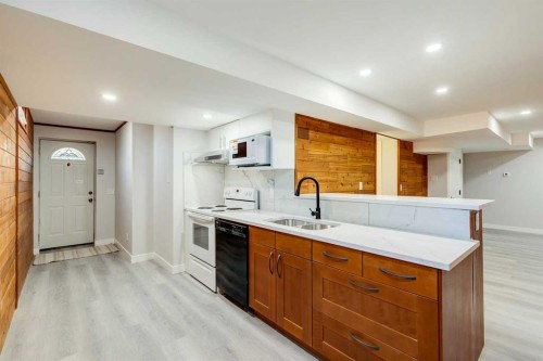 3020 Palliser Drive Sw, Calgary, AB - Indoor Photo Showing Kitchen With Double Sink