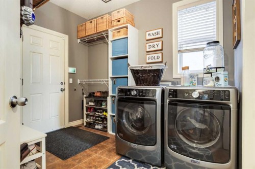 27 Tuscany Estates Drive Nw, Calgary, AB - Indoor Photo Showing Laundry Room