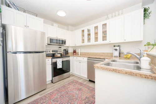 165 Bayside Point Sw, Airdrie, AB - Indoor Photo Showing Kitchen With Stainless Steel Kitchen With Double Sink