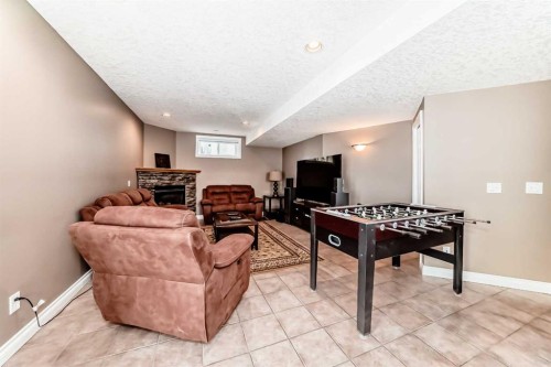 146 Scenic View Close Nw, Calgary, AB - Indoor Photo Showing Other Room With Fireplace