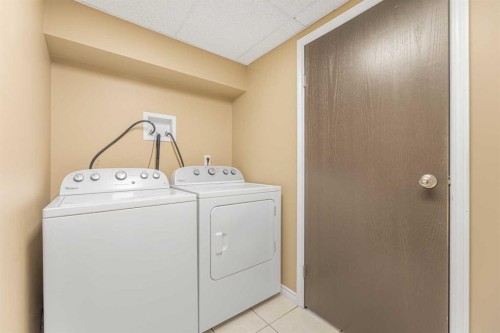 215 Hidden Vale Place Nw, Calgary, AB - Indoor Photo Showing Laundry Room