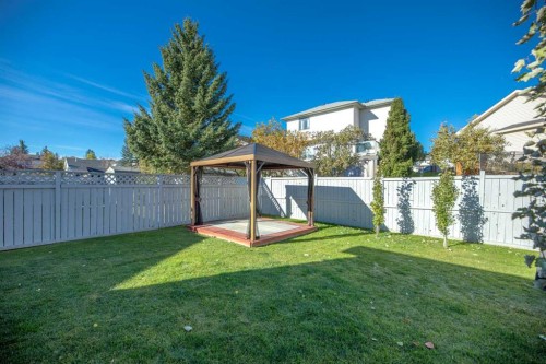 215 Hidden Vale Place Nw, Calgary, AB - Outdoor With Backyard