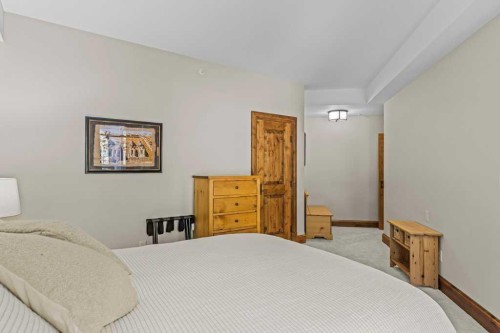 303-150 Stonecreek Road, Canmore, AB - Indoor Photo Showing Bedroom