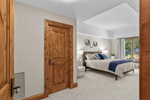 303-150 Stonecreek Road, Canmore, AB - Indoor Photo Showing Bedroom