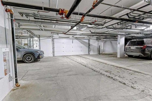 305-30 Sage Hill Walk Nw, Calgary, AB - Indoor Photo Showing Garage