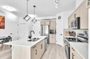 305-30 Sage Hill Walk Nw, Calgary, AB  - Indoor Photo Showing Kitchen With Stainless Steel Kitchen With Double Sink With Upgraded Kitchen 