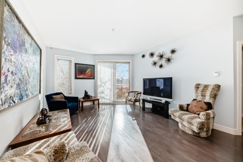 3104-15 Sunset Square, Cochrane, AB - Indoor Photo Showing Living Room