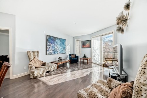 3104-15 Sunset Square, Cochrane, AB - Indoor Photo Showing Living Room