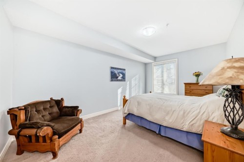3104-15 Sunset Square, Cochrane, AB - Indoor Photo Showing Bedroom