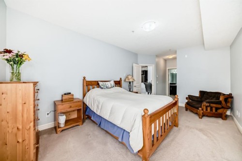 3104-15 Sunset Square, Cochrane, AB - Indoor Photo Showing Bedroom