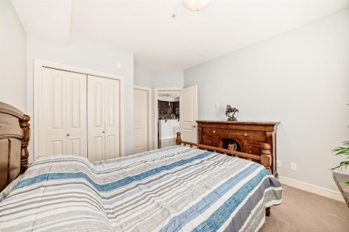 3104-15 Sunset Square, Cochrane, AB - Indoor Photo Showing Bedroom