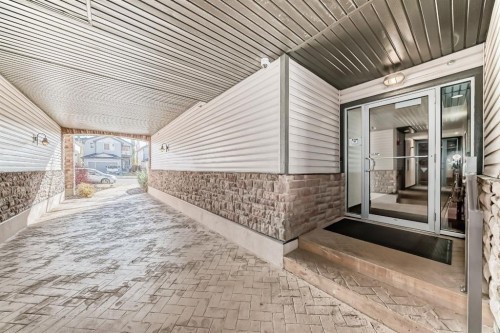 3104-15 Sunset Square, Cochrane, AB - Outdoor With Exterior