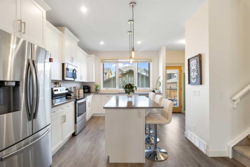112 Fireside Crescent, Cochrane, AB - Indoor Photo Showing Kitchen With Stainless Steel Kitchen With Upgraded Kitchen